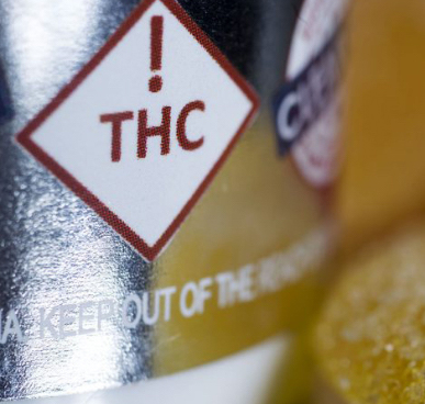 A bottle with a THC warning symbol.